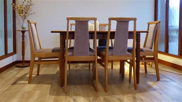 table and chairs on a wood type floor
