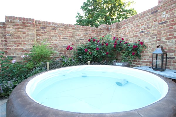 Hot tub in walled garden