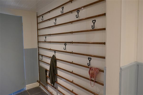 A handy drying wall to help dry off your towels and clothing after a day at the beach 