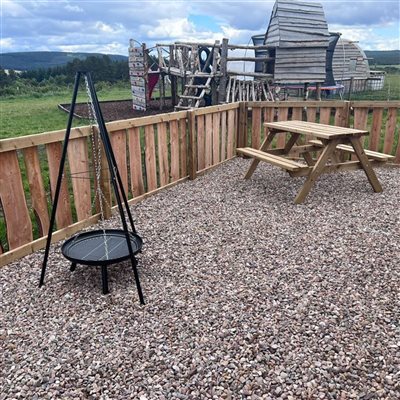 BBQ, playpark and seating at cabin