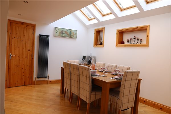 spacious dining area adjacent to kitchen