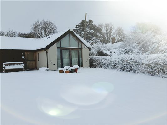 Jack Bridge Cottage in the snow.
