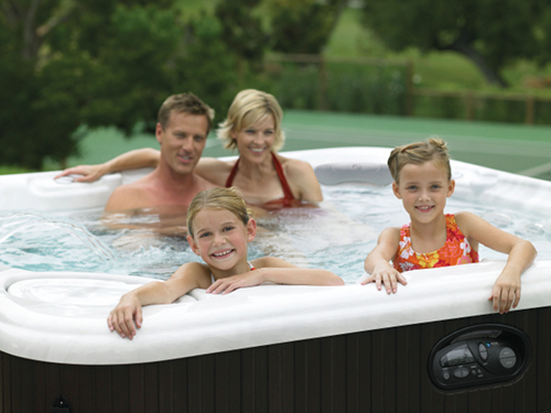 Family enjoying hot tub