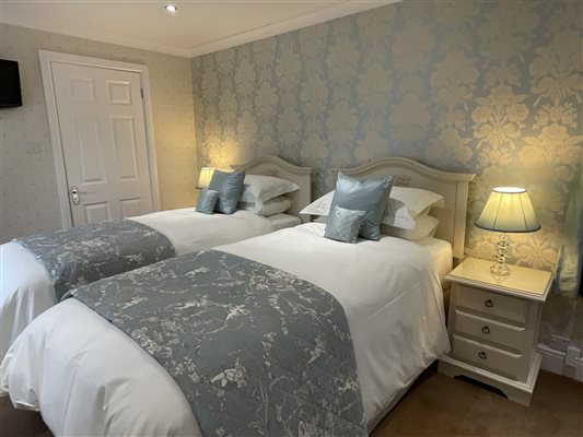 Twin beds in largest bedroom.