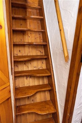 stairs up to single bedroom