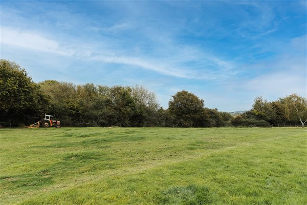 open field with tractor