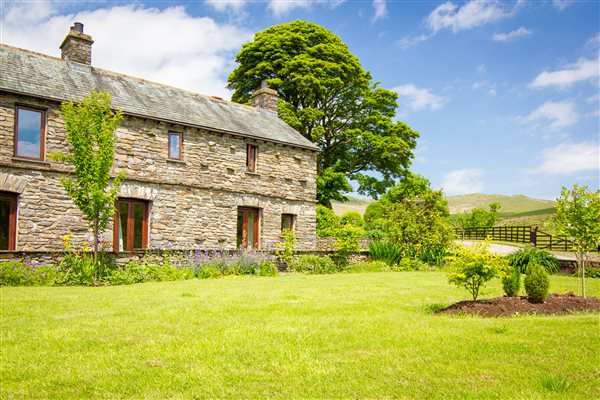 Front Garden with Patio Doors leading from the 2 Bedrooms and Fell Views Beyond.