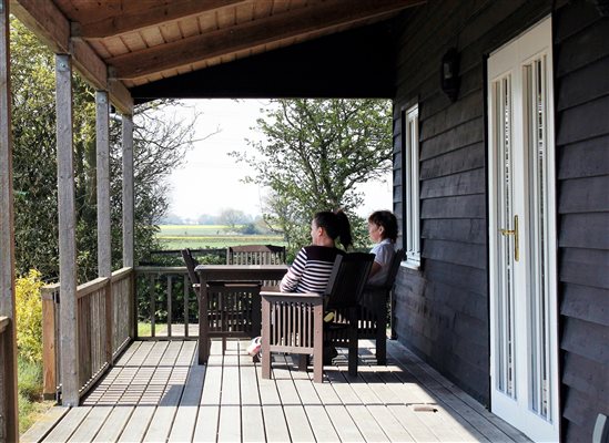 Enjoying drinks on the verandah at Kingfisher Lodge