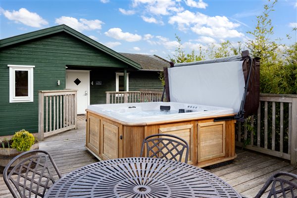 hot tub in wooden lodge