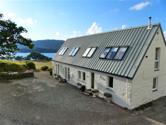 long holiday cottage, loch and trees