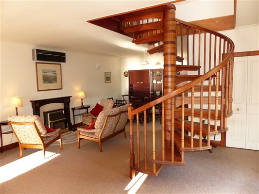 Sprial staircase and seating in large lounge