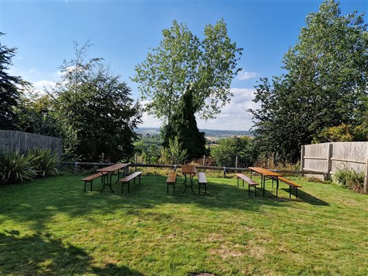 group seating available for large bookings shown in the milking parlour garden