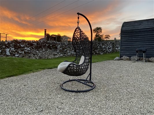 Swinging seat at sunset