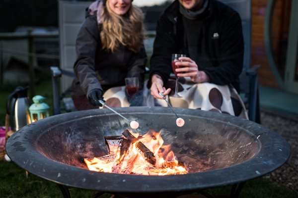 toasting marshmallows round the firepit 