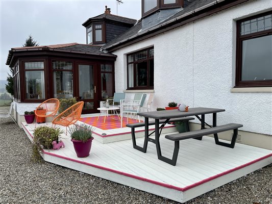 Outdoor decking with a table and seats