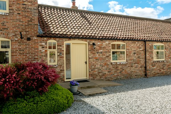 brick cottage with cream door