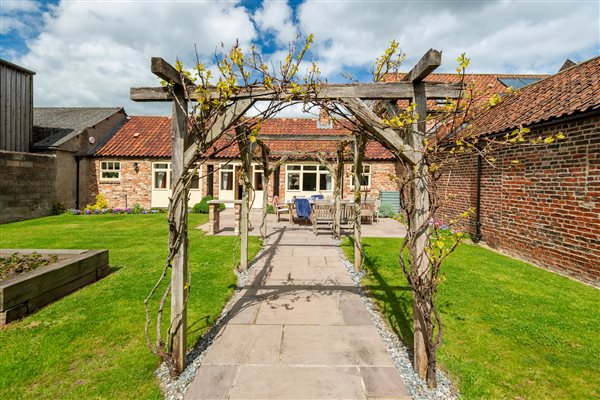 cottage garden with pergola