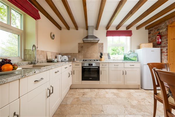 fitted cream kitchen with oven 