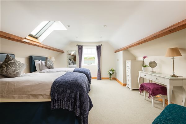 room with 2 single beds and rooflights