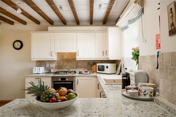 Cream kitchen with granite worktops