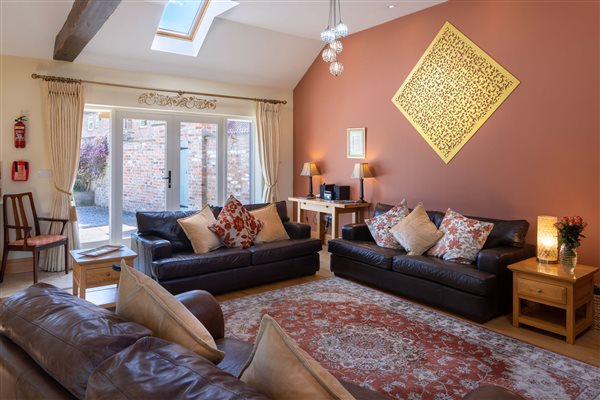 Sitting room with 3 leather sofas