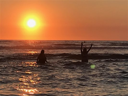 Swimming at sunset