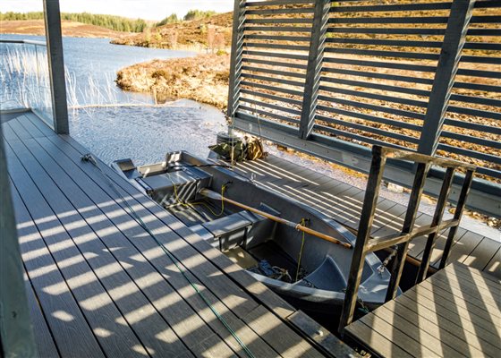 Boathouse pontoon and fishing boat