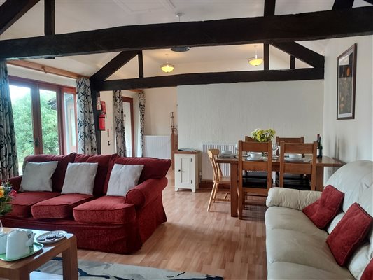 Linhay open plan living area with exposed beams