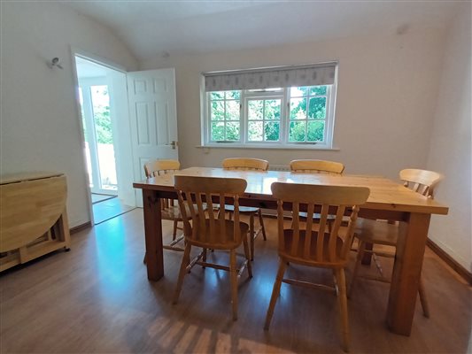 Shippon dining room with additional table and chairs for multi-cottage bookings