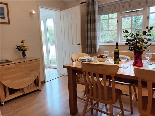 Shippon at Lower Hearson Farm Cottages - dining area with additional fold out table for group bookings