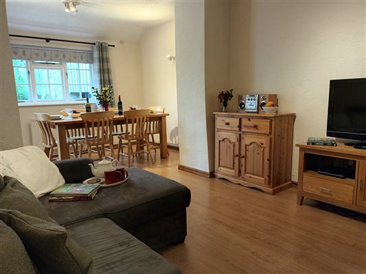Shippon at Lower Hearson Farm Cottages - snug and dining area