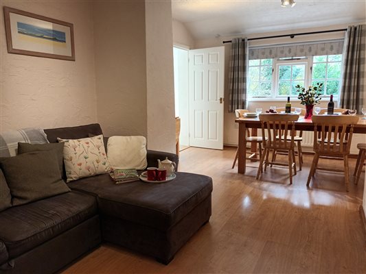 Shippon at Lower Hearson Farm Cottages - snug and dining area