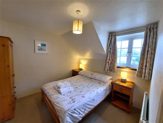 Threshing Barn double bedroom. Towels provided and plenty of storage. Travel cot available on request