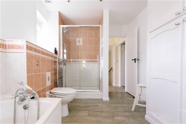 Bathroom with bath and shower