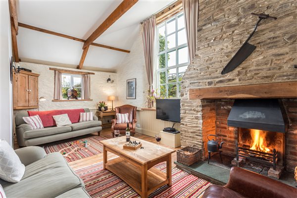 Geoff Barn living room with open fire 