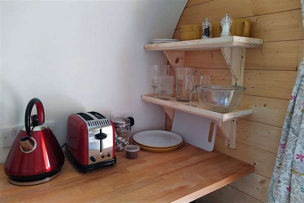 Shelving inside pod with toaster and kettle Shelving inside pod with toaster and kettle