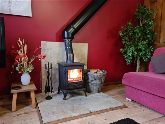 Relax in front of the cosy woodburning stove