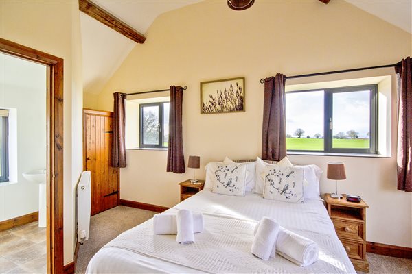 Double bedroom with en-suite shower room and countryside views