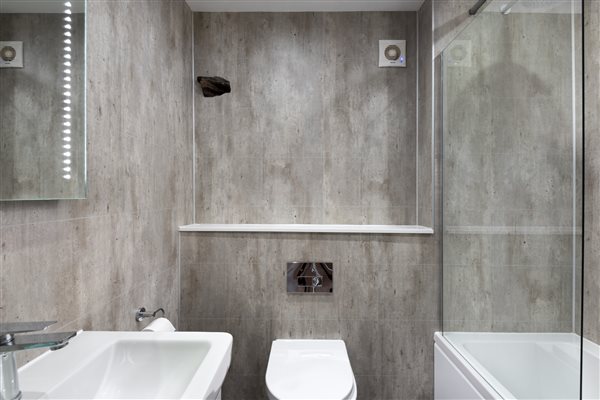 second bathroom with shower over bath and panelling