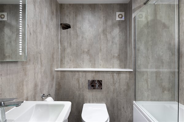second bathroom with shower over bath and panelling