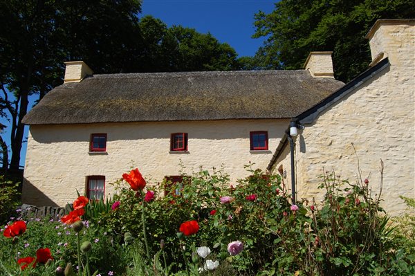 Thatched Treberfedd eco holiday grade II listed Welsh Georgian vernacular farmhouse