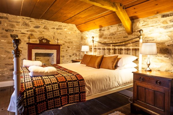 Thatched Treberfedd eco holiday grade II listed Welsh Georgian vernacular farmhouse