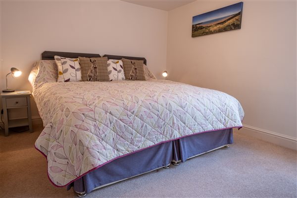 Super king bedroom at Pickwell Barton Cottage