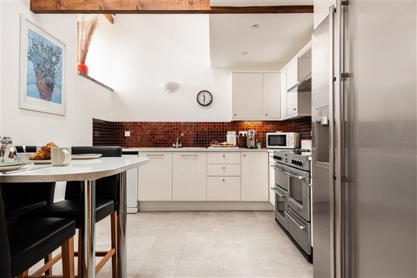 Threshing Barn kitchen with breakfast bar and stools