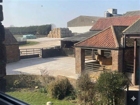 View over stable and farm yard 