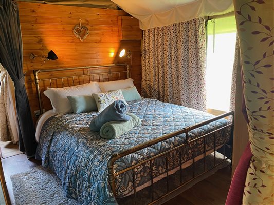 bedroom in a glamping tent