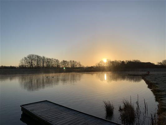 Fishing lake reservoir sunrise peaceful tranquil Lincolnshire 
