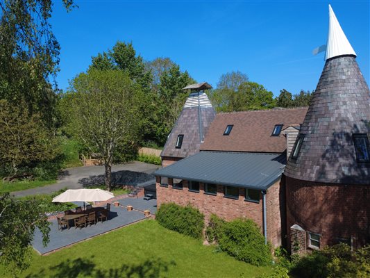 View of Hop Kilns, garden, parking, cowl, patio and blue skies
