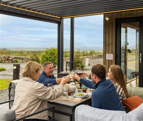 Outdoor dining on covered pergola Outdoor dining on covered pergola