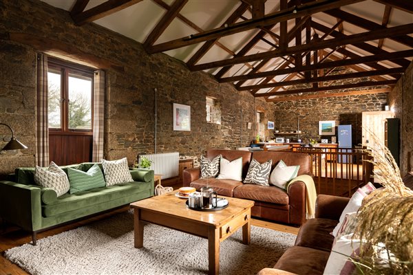 Living room with vaulted, beamed ceiling